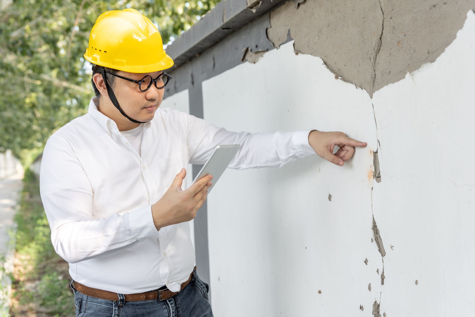 Real Estate Property Appraisal. Man Inspecting House